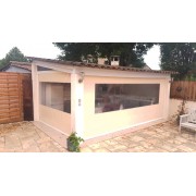 Store transparent motorisé pour pergola